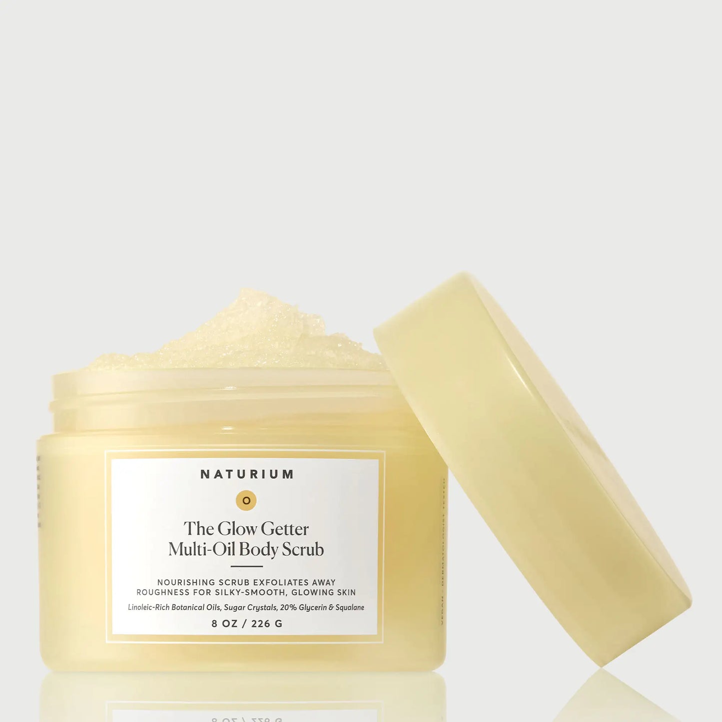 the-glow-getter-multi-oil-body-scrub-y3 NATR-40028-GlowGetter-Multi-Oil-Body-Scrub-Front-CapOff-bonebkgd.webp