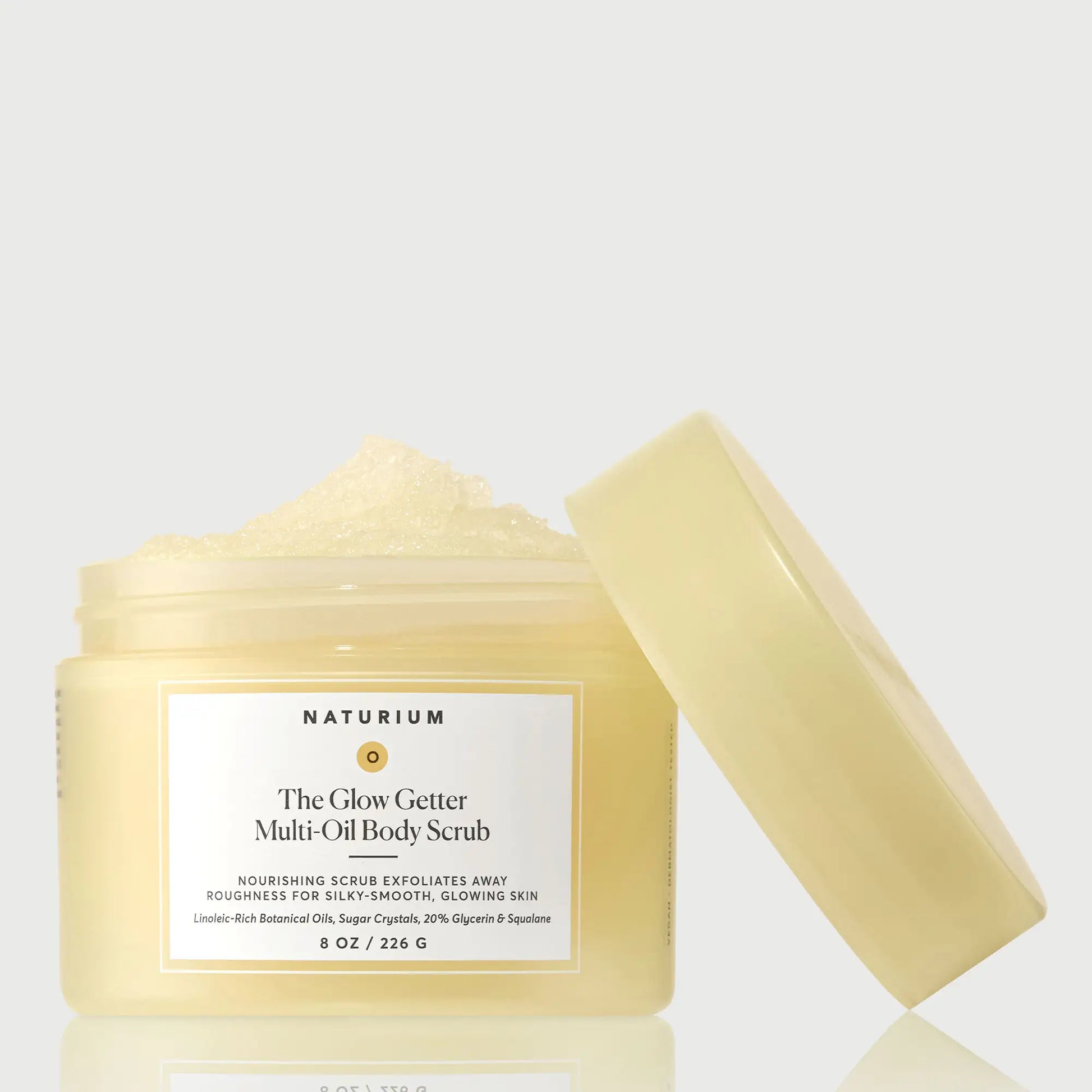 the-glow-getter-multi-oil-body-scrub-y3 NATR-40028-GlowGetter-Multi-Oil-Body-Scrub-Front-CapOff-bonebkgd.webp